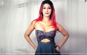 Singer and Actress, Jasleen Matharu, looks tempting with red hair